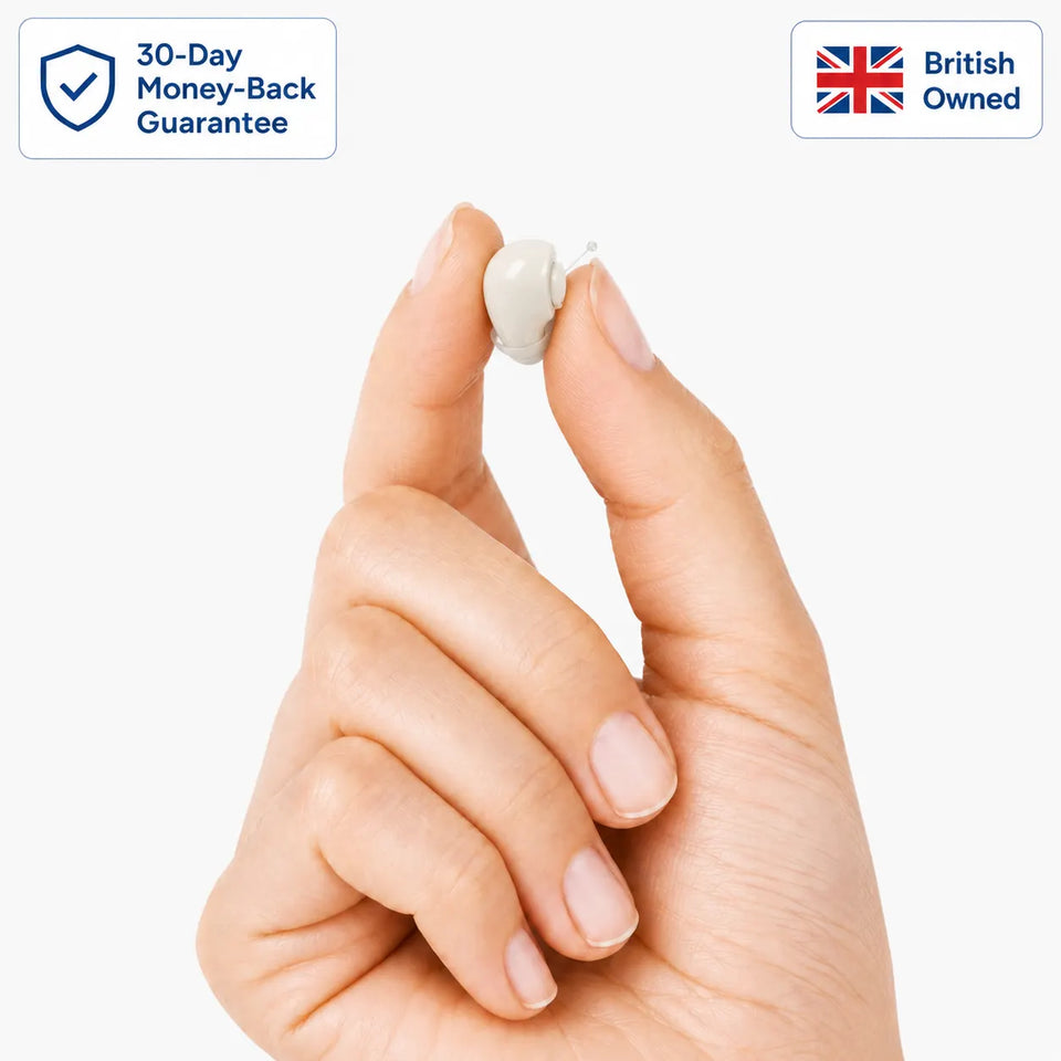 WiseHear Clarity Pro hearing aid held between fingers